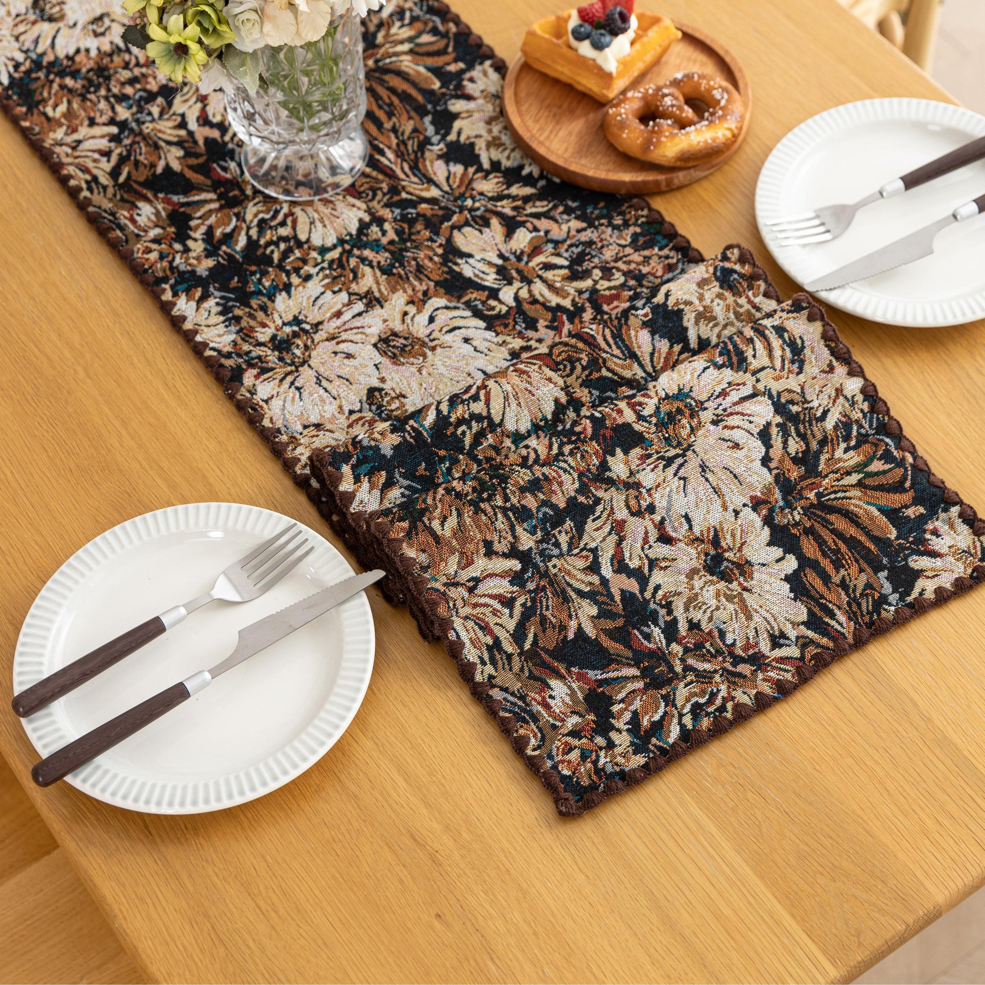 Elegant Floral Table Runner – Elevate your dining experience with this sophisticated table runner featuring an artistic floral pattern in rich, earthy tones. The dark background enhances the intricate botanical design, adding depth and elegance to your table setting. Perfect for formal dinners, festive gatherings, or everyday décor, this durable and stylish runner complements a variety of interior styles, from classic to modern.
