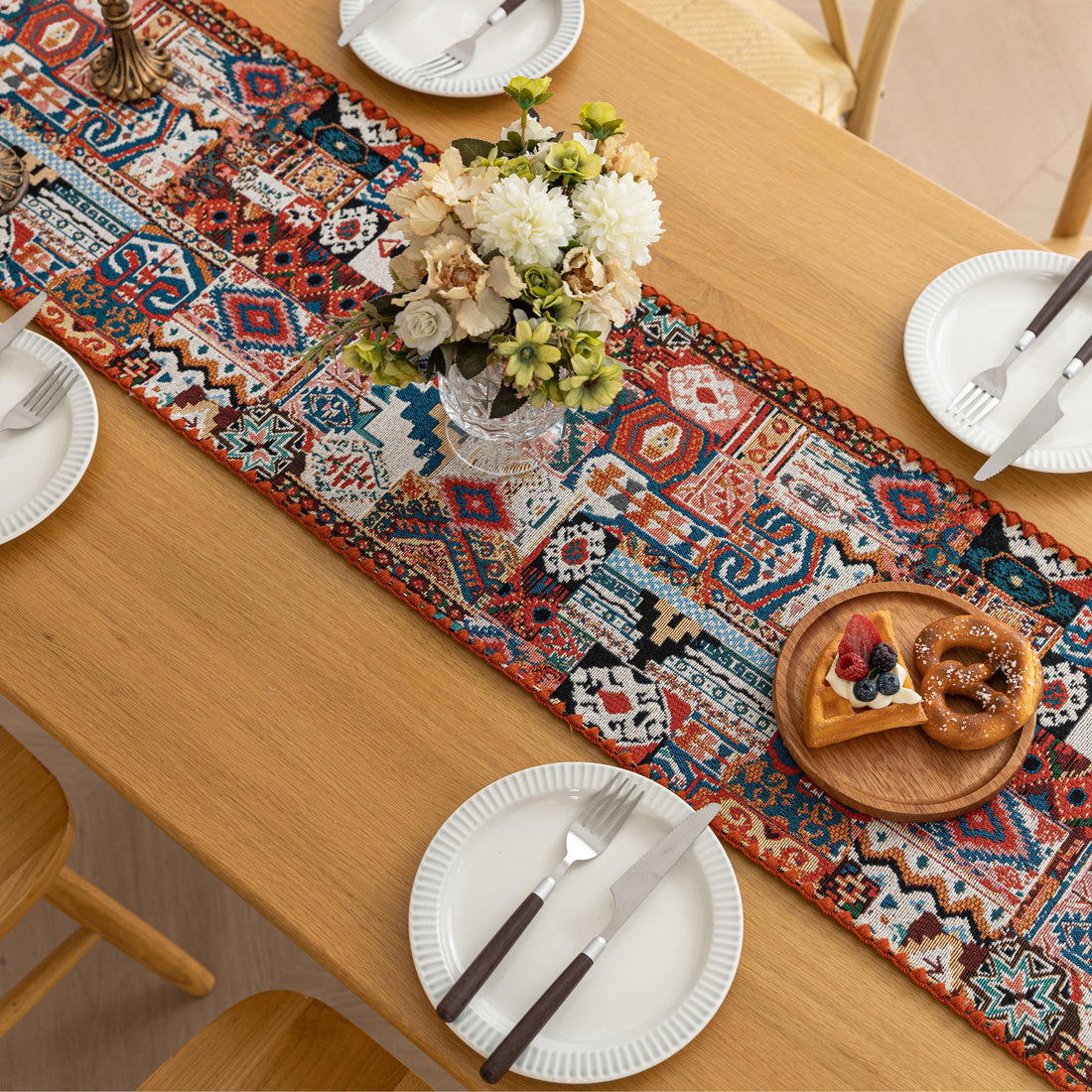 Colorful Bohemian Table Runner – Add a touch of vibrant charm to your dining table with this intricately patterned boho-style table runner. Featuring rich earthy tones, geometric motifs, and a woven texture, it’s perfect for elevating everyday meals or special gatherings. Ideal for coffee tables, dining settings, or sideboards, this decorative runner blends rustic warmth with artistic flair.

